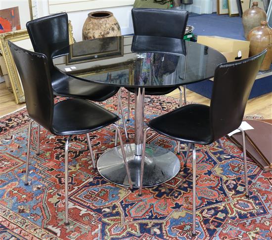 A glass circular breakfast table and a set of four leather and tubular chrome dining chairs W.100cm